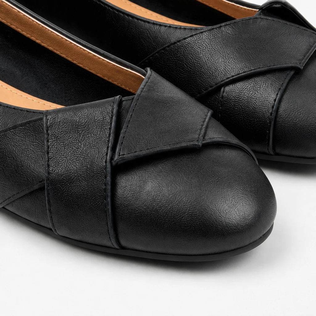 Close-up detail of woven-look flat shoe texture and rounded toe